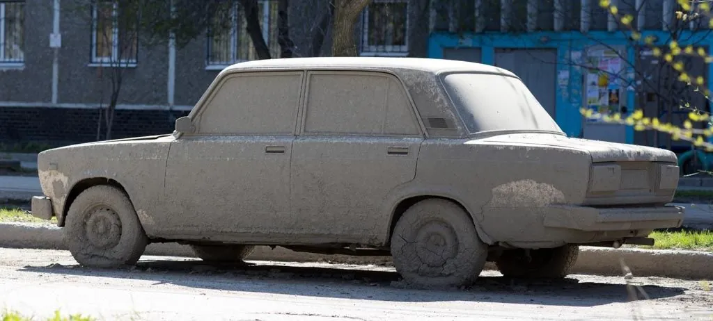Old car with faded, weathered paint