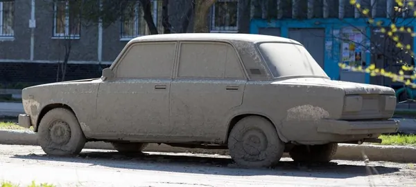 Old car with faded, weathered paint