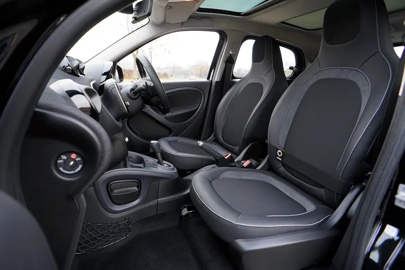 Clean detailed car interior with polished dashboard and seats