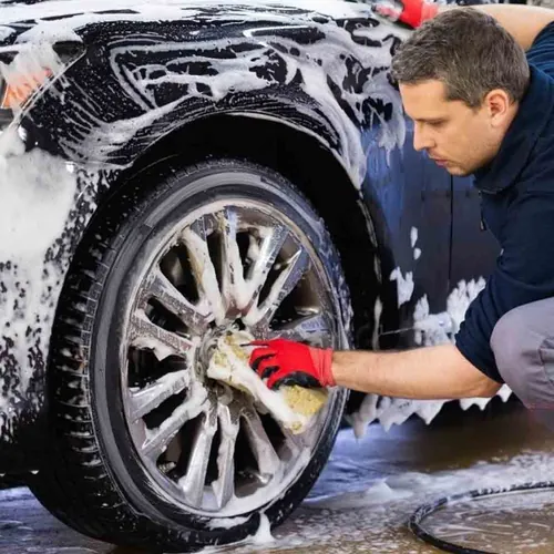 Ben washing a car rim